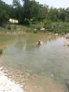 Sitting in cool, shallow creek water - Greg