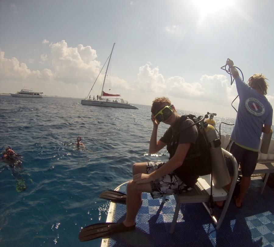 Conner getting ready to giant stride from boat