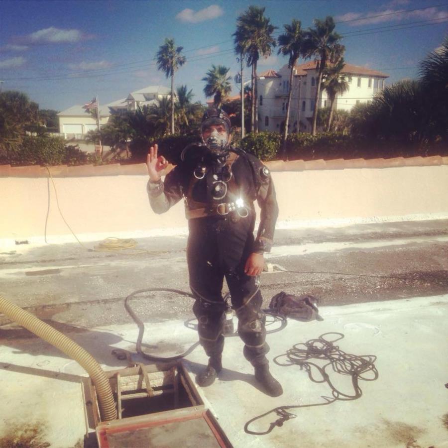 Removing sediment from a water tank in Melbourne Beach, Florida