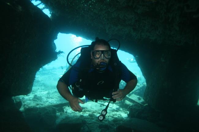 Mala Ramp (Lahaina Pier) - My buddy diving through some ramp wreckage.  Mala Ramp