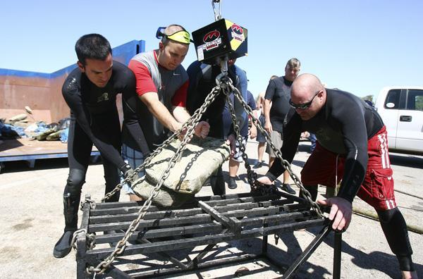 At the weigh-in with large concrete blocks recovered from river