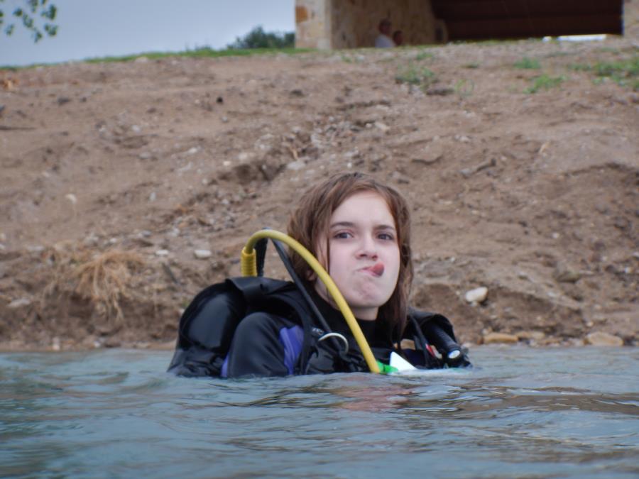 Wheeler Branch Lake - Pic of Daughter at WB, meaning to show the consistency of the shore and pavilion behind her.