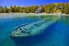 View of Sweepstakes shipwreck through clear water.