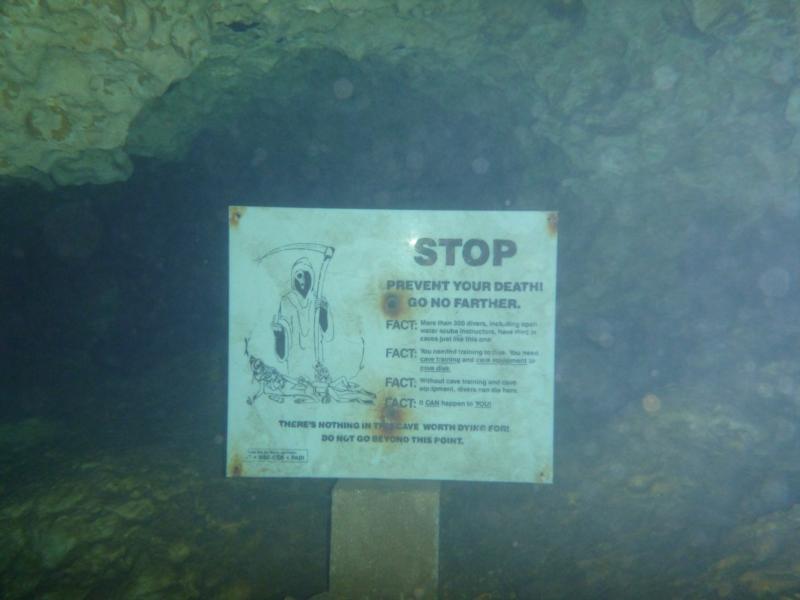 Sign in front of an underwater cave in Devil's Den