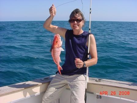 Kathy with small snapper, ultradive.com