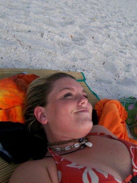 laying on the beach on Anna Maria Island, FL