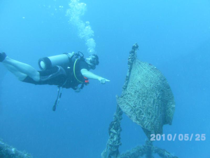 Key Largo, flag fluttering in the current on USS Spiegel Grove