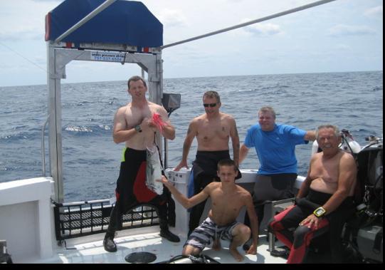 Holding King Mackerel bitten in half by barracuda while reeling in, Hatteras, NC August 13, 2011