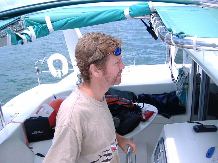 Jeff piloting a 50 foot catamaran sailboat