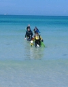 Sue at the beach with students