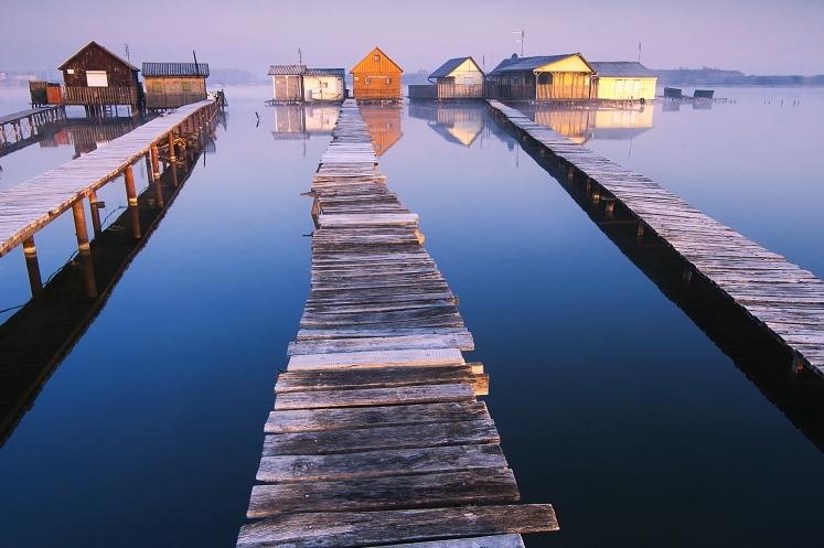 Houses on Lake in Bokod Hungary with wooden walkways