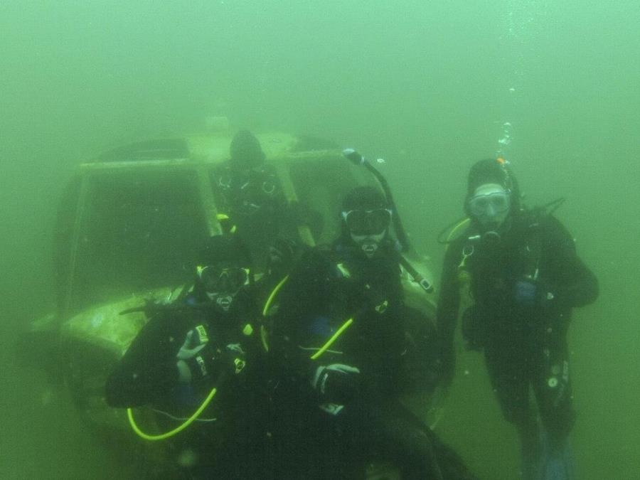 Dive buddy and I sitting on a blackhawk