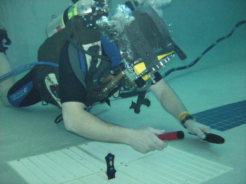 Practice with commercial helmet - replacing grates at local pool