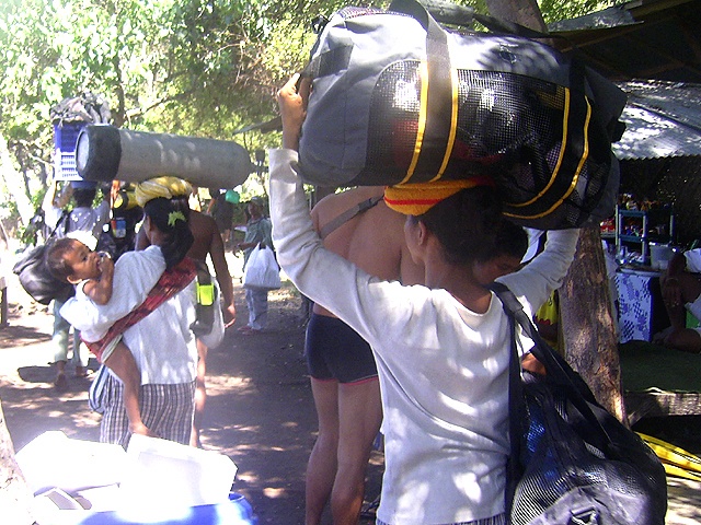 Tulamben women carry tanks on their head...