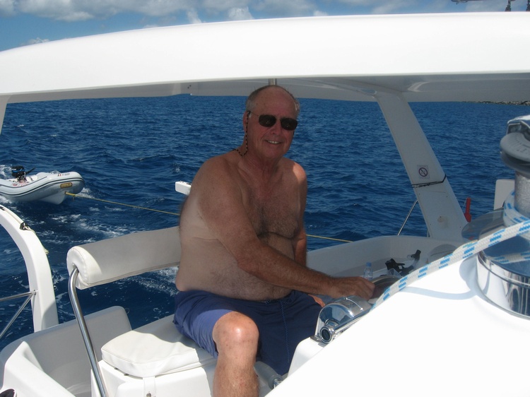 Hugh at helm of Moonshadow BVI, 43` Cat.