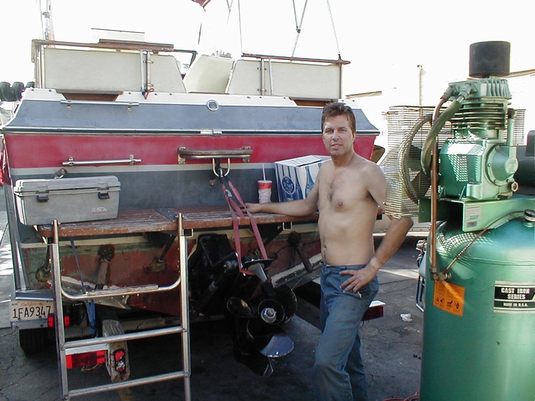 CALIFORNIAKEITH workin on the boat, notice the long ladder & a water sking ring.