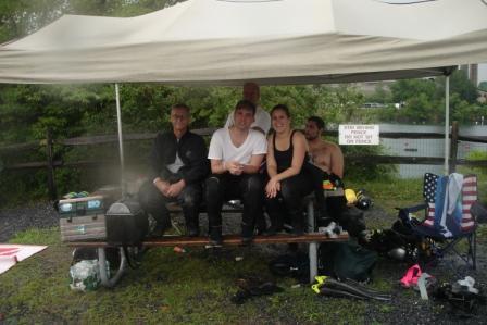 AOW CLASS AND INSTRUCTOR SEEK SHELTER FROM THE RAIN