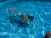 My daughter in pool with pony