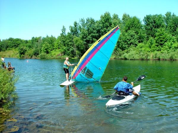 Divemaster Mike wishing he had a breeze and owner Scott on the kayak.