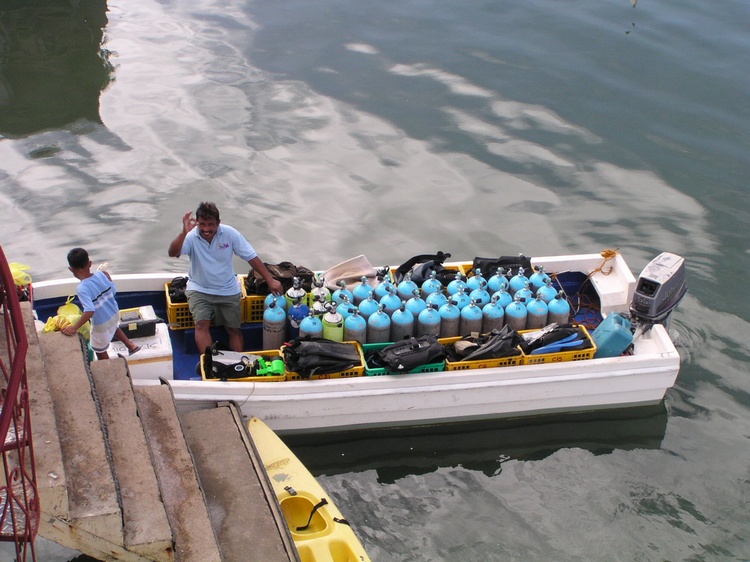 2/2004 - Nanoy loading up for the day - Coron, PI