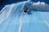 Daughter surfing at water park Wild Wadi Dubai UAE