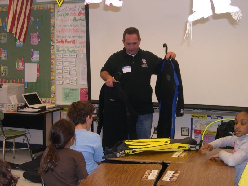 Invited to a school to teach students about scuba