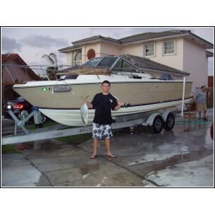 My son and his catch with my boat