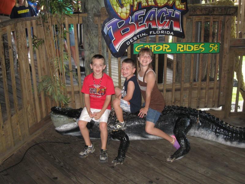 Colton,Carter,and Hannah Riding an alligator